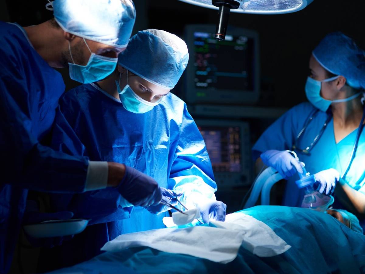 Doctors perform surgery in a high-tech medical facility.