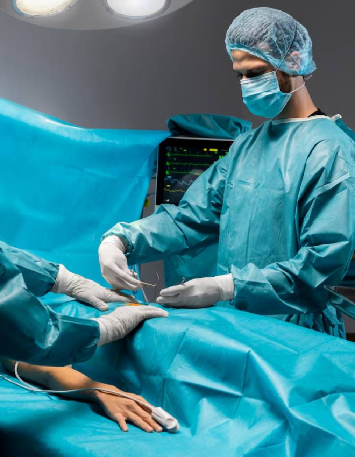 Medical professionals performing surgery in a hospital operating room.
