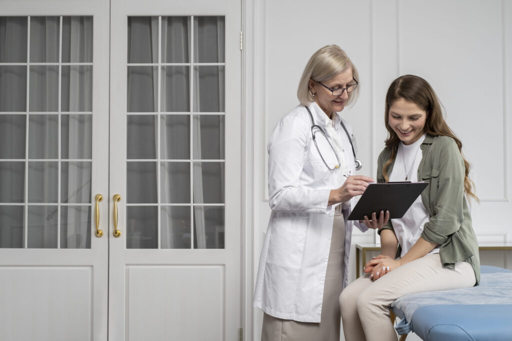 Doctor consulting a smiling woman in a modern clinic setting.